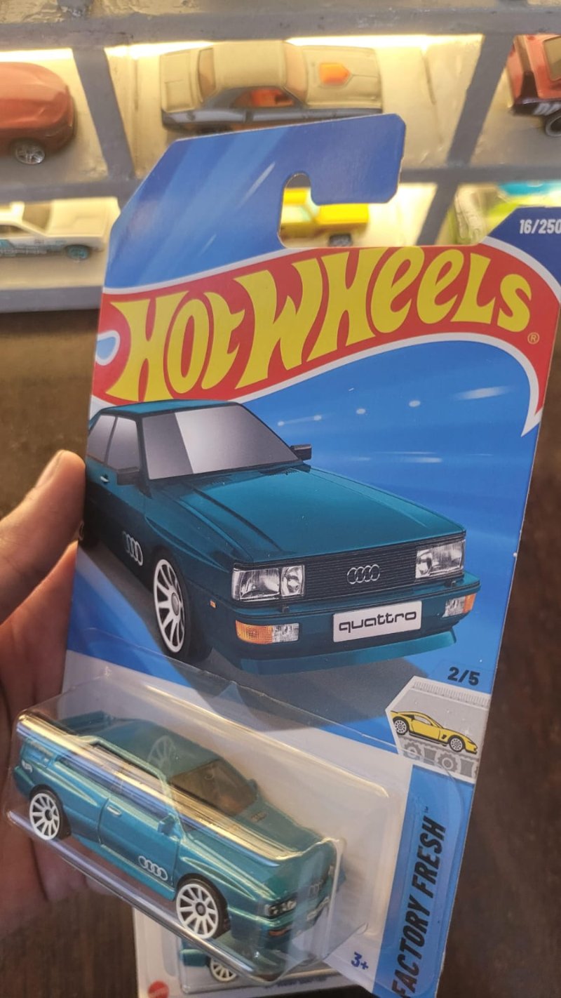 Angled view of Hot Wheels 1987 Audi Quattro Greenish Blue A Case die-cast model