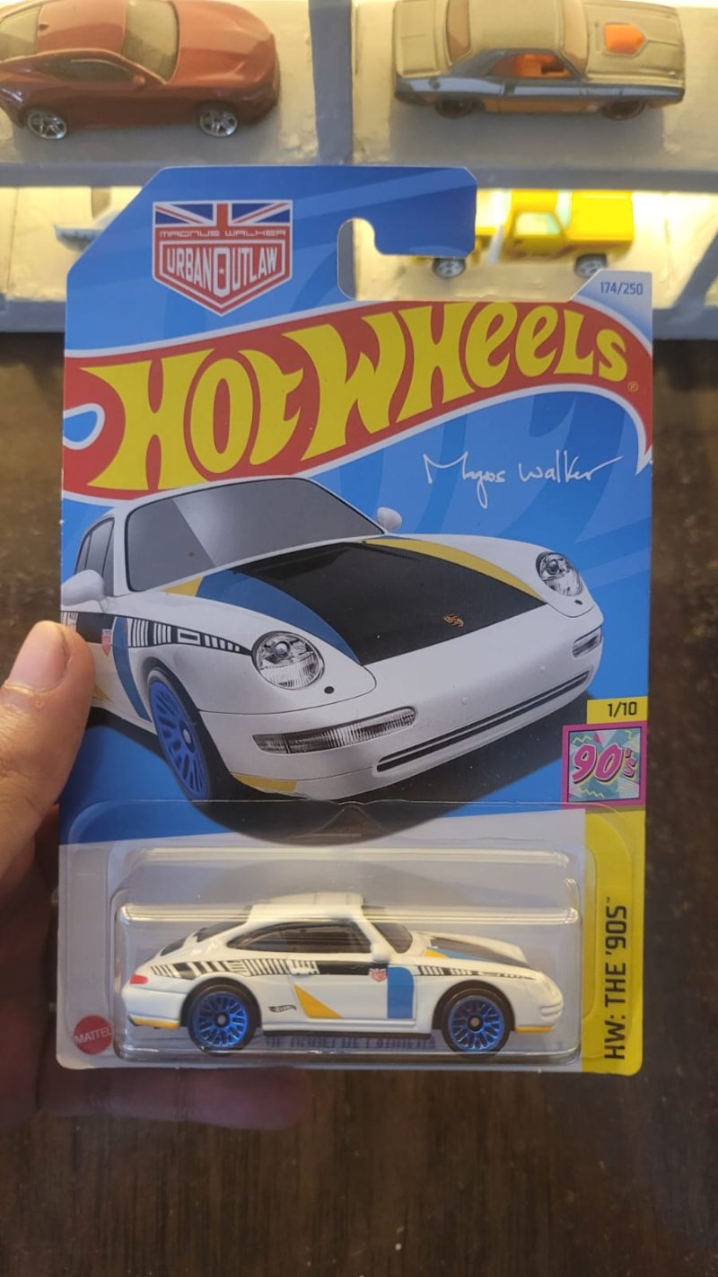 Hot Wheels 1996 Porsche Carrera White Q Case showcased in collector's display