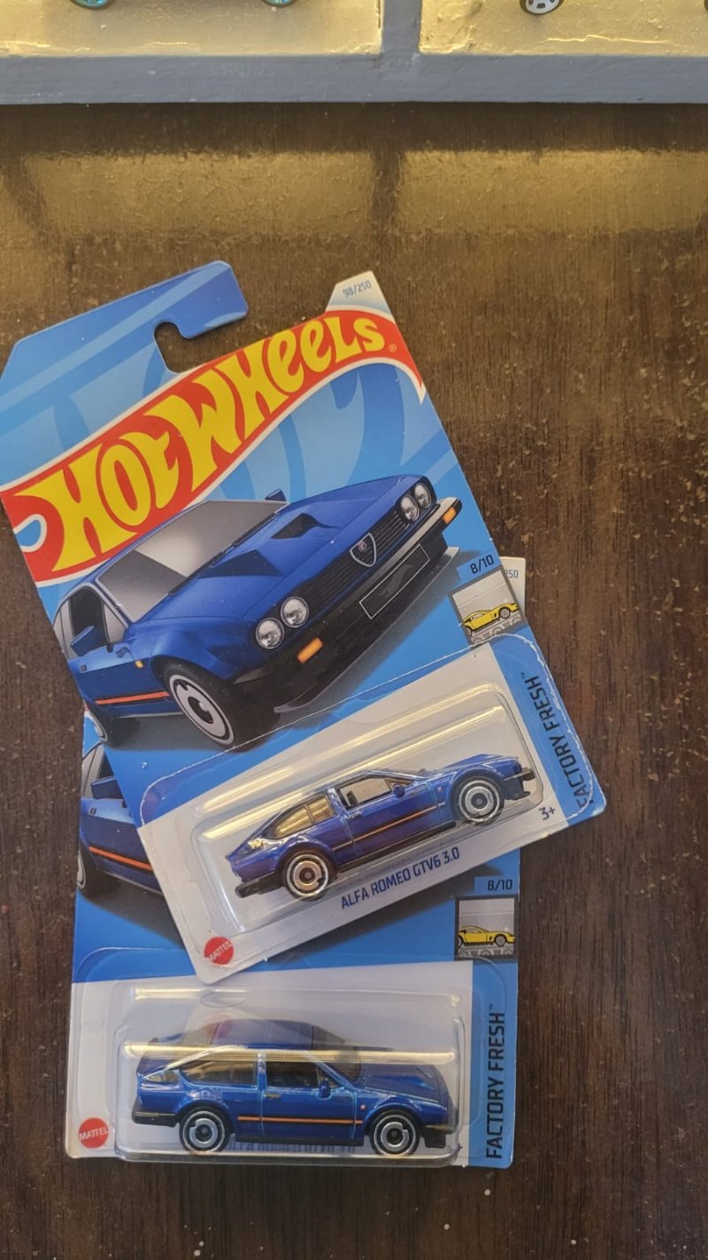 Hot Wheels Alfa Romeo GTV6 3.0 Blue showcased in a collector's display