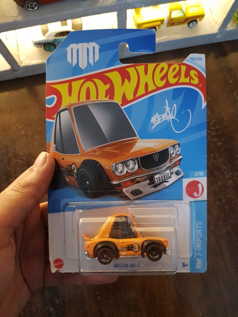Front view of Hot Wheels Mazda RX-3 Orange die-cast model