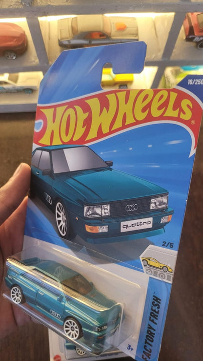 Angled view of Hot Wheels 1987 Audi Quattro Greenish Blue A Case die-cast model