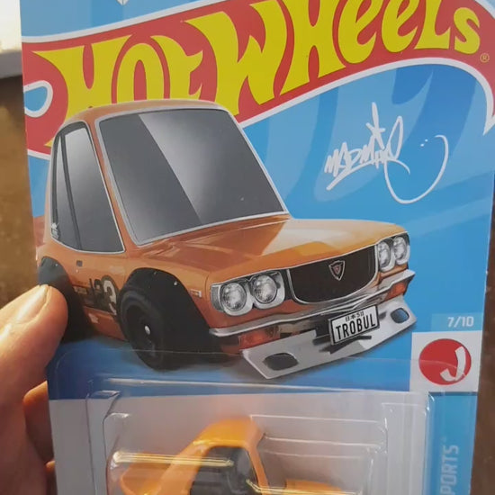 Showcase of Hot Wheels Mazda RX-3 Orange die-cast model