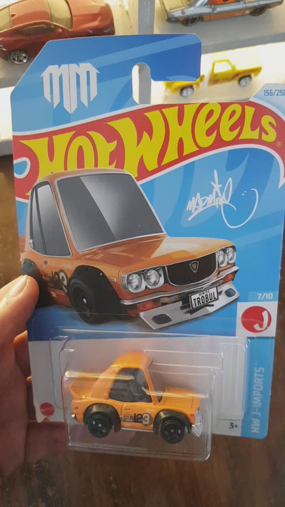Showcase of Hot Wheels Mazda RX-3 Orange die-cast model