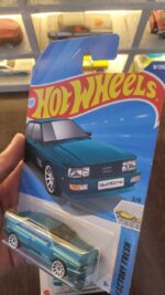 Angled view of Hot Wheels 1987 Audi Quattro Greenish Blue A Case die-cast model