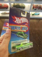 Rear view of Hot Wheels Ultra Hots '64 Dodge 330 die-cast vehicle