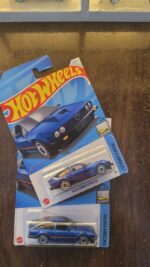 Hot Wheels Alfa Romeo GTV6 3.0 Blue showcased in a collector's display