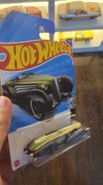 Rear view of Hot Wheels Mainline Custom Cadillac Fleetwood die-cast vehicle