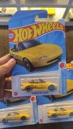 Front view of Hot Wheels Mainline 1991 Mazda MX-5 Miata yellow die-cast car