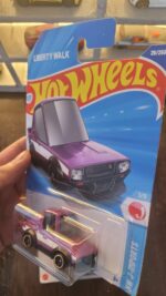 Hot Wheels Mainline Nissan Skyline 2000GT-R LBWK Tooned displayed in a collection