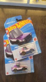 Hot Wheels Mainline Nissan Skyline 2000GT-R LBWK Tooned displayed in a collection