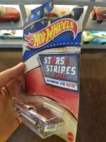 Angled view of Hot Wheels Stars and Stripes '64 Pontiac GTO collectible