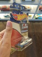 Rear view of Hot Wheels Stars and Stripes '68 HEMI Barracuda die-cast model