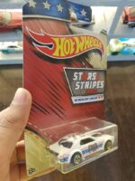 Rear view of Hot Wheels Stars and Stripes '68 Mercury Cougar die-cast vehicle