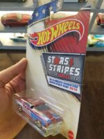 Angled view of Hot Wheels Stars and Stripes '68 Plymouth Barracuda die-cast model