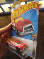 Angled view of Hot Wheels Surf Duty beach patrol die-cast vehicle