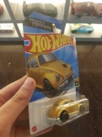 Rear view of Hot Wheels Transformers Bumblebee in gold die-cast vehicle